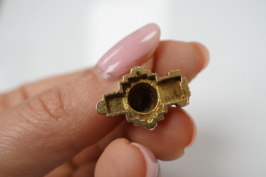 Three assorted 9ct gold charms, including Guernsey milk can and 'Ye Olde Smithy' and one other yellow metal charm, gross 14 grams. Condition - fair to good